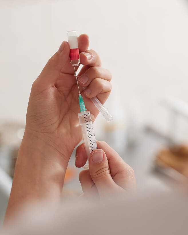 A medical professional administering an B12 injection