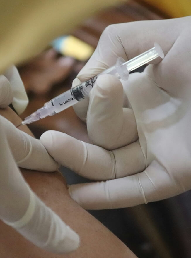 A medical professional administering an B12 injection