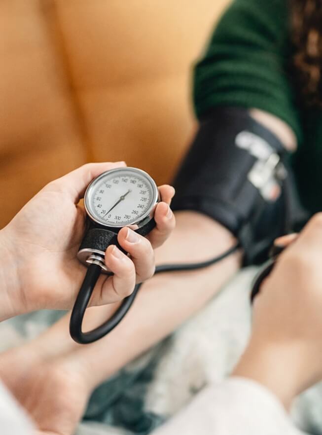 Professional measuring patient blood pressure