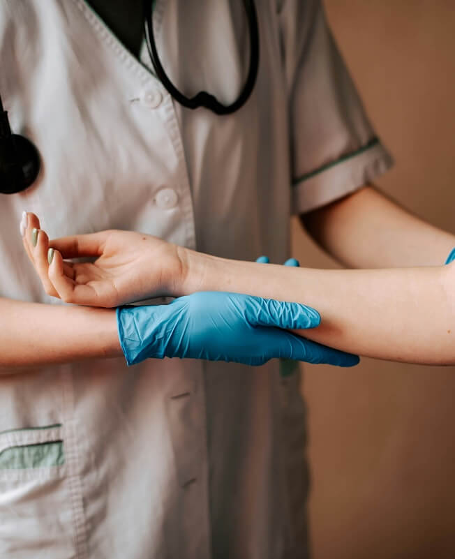 Medical professional check patient's arm