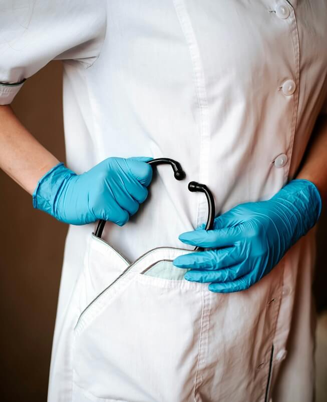 A healthcare professional holding a stethoscope