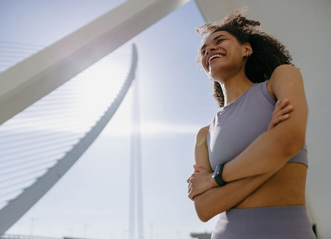 Woman smiling with sunlight on her