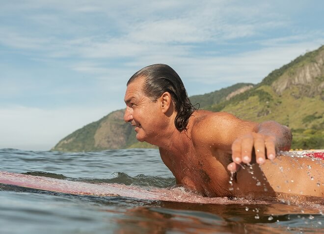 Middle aged man surfing