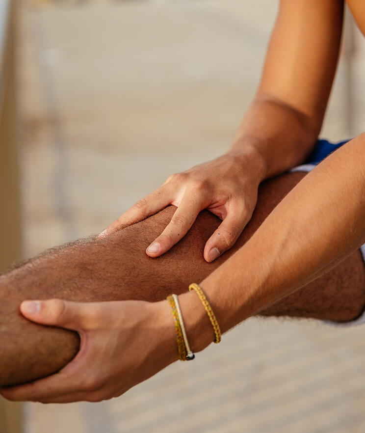 Person holding and stretching their knee