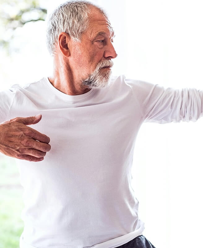 Older man doing yoga