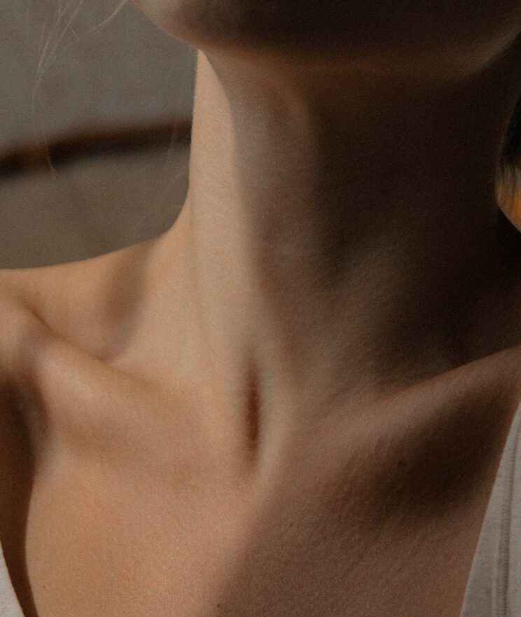 Close-up of person's neck area
