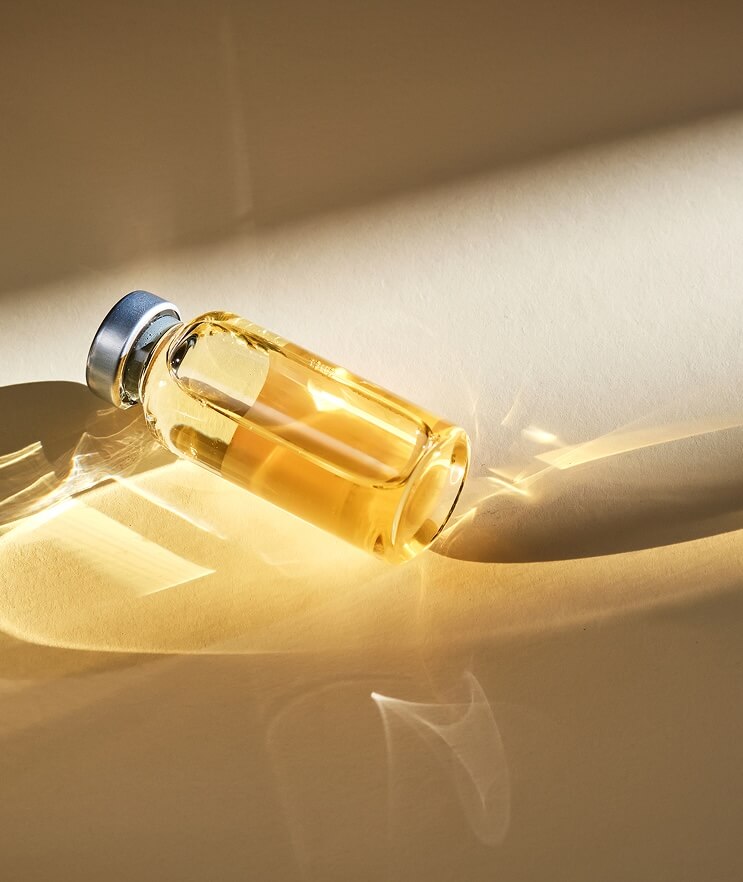 A medical glass vial with vitamin D