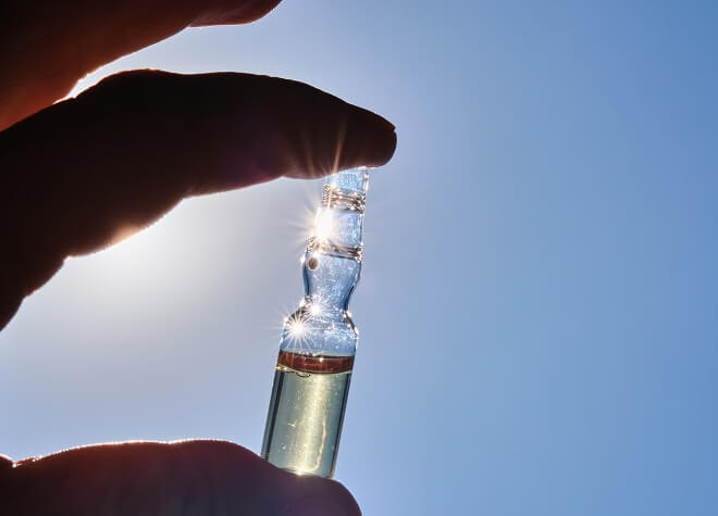 A medical glass vial with vitamin D