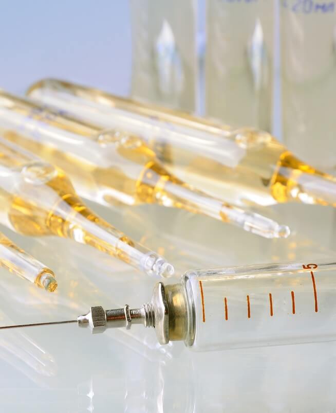 A medical glass vial with vitamin D