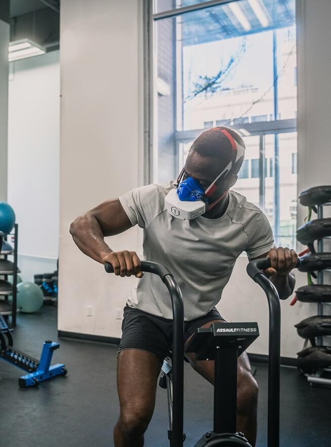 A person undergoing a Vo2 max test on a stationary bike
